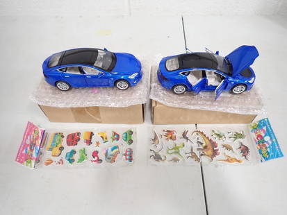 2 Die Cast Cars Model S Blue New in Box .  They Light Up and Make an Engine Sound: Lot of 2 Die Cast Toy Car Model S Blue New in Box .&#160; These make an engine sound and light up.&#160; You Also get 2 packs of stickers.  All pictures are considered part of the description and shou