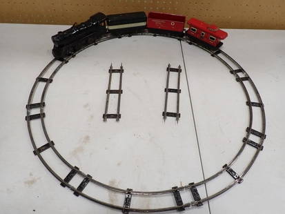 Model Train Lot - Vintage Marx Tin Wind Up (works) with car and caboose plus track: Model Train Lot - Vintage Marx Tin Wind Up (works) with car and caboose plus track All pictures are considered part of the description and should be examined carefully by bidders. Live Auctioneers is