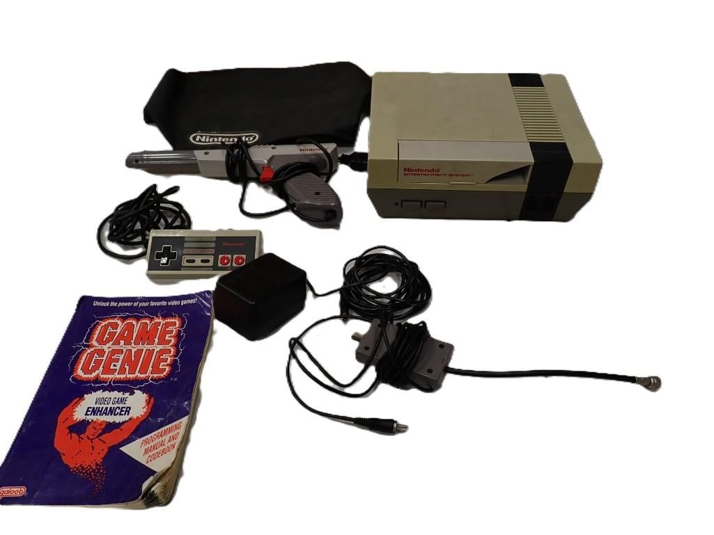 NES Nintendo Entertainment System Video Game System with Light Gun, Controller, Power and RF Cord: NES Nintendo Entertainment System Video Game System with Light Gun, Controller, Power and RF Cord and Game Genie code book. System is untested and the case has a crack. All pictures are consider