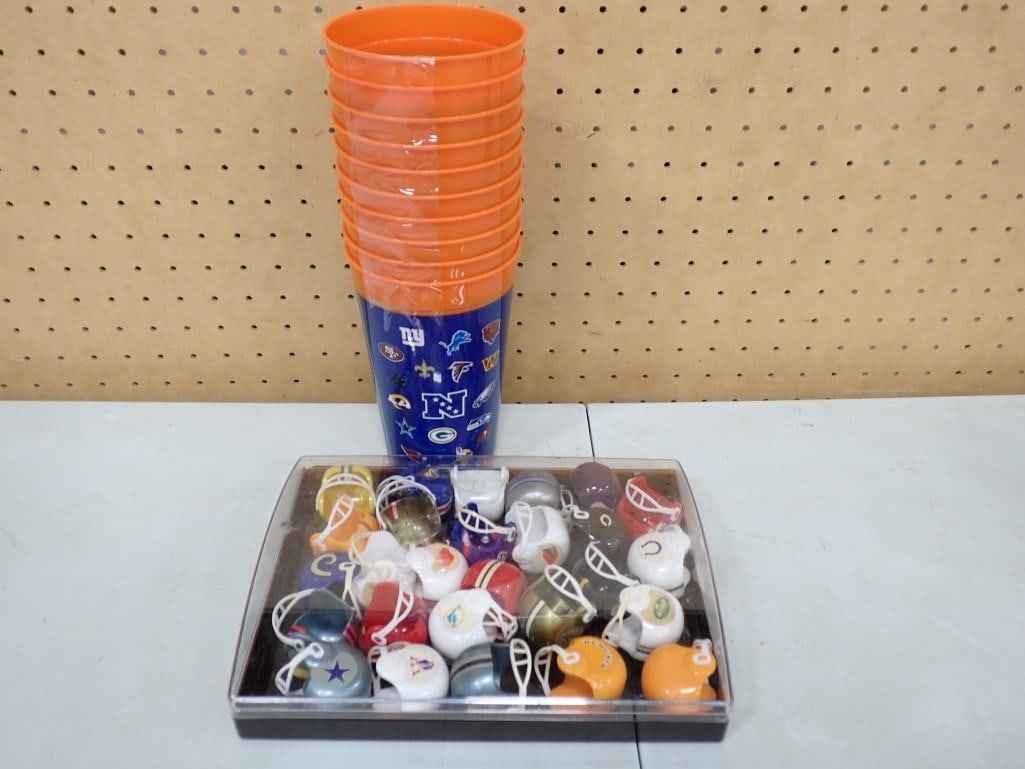 Lot of Mini Football Helmets in a Display Box and Sports Teams Plastic Cups: Lot of Mini Football Helmets in a Display Box and Sports Teams Plastic Cups All pictures are considered part of the description and should be examined carefully by bidders. Live Auctioneers is now o
