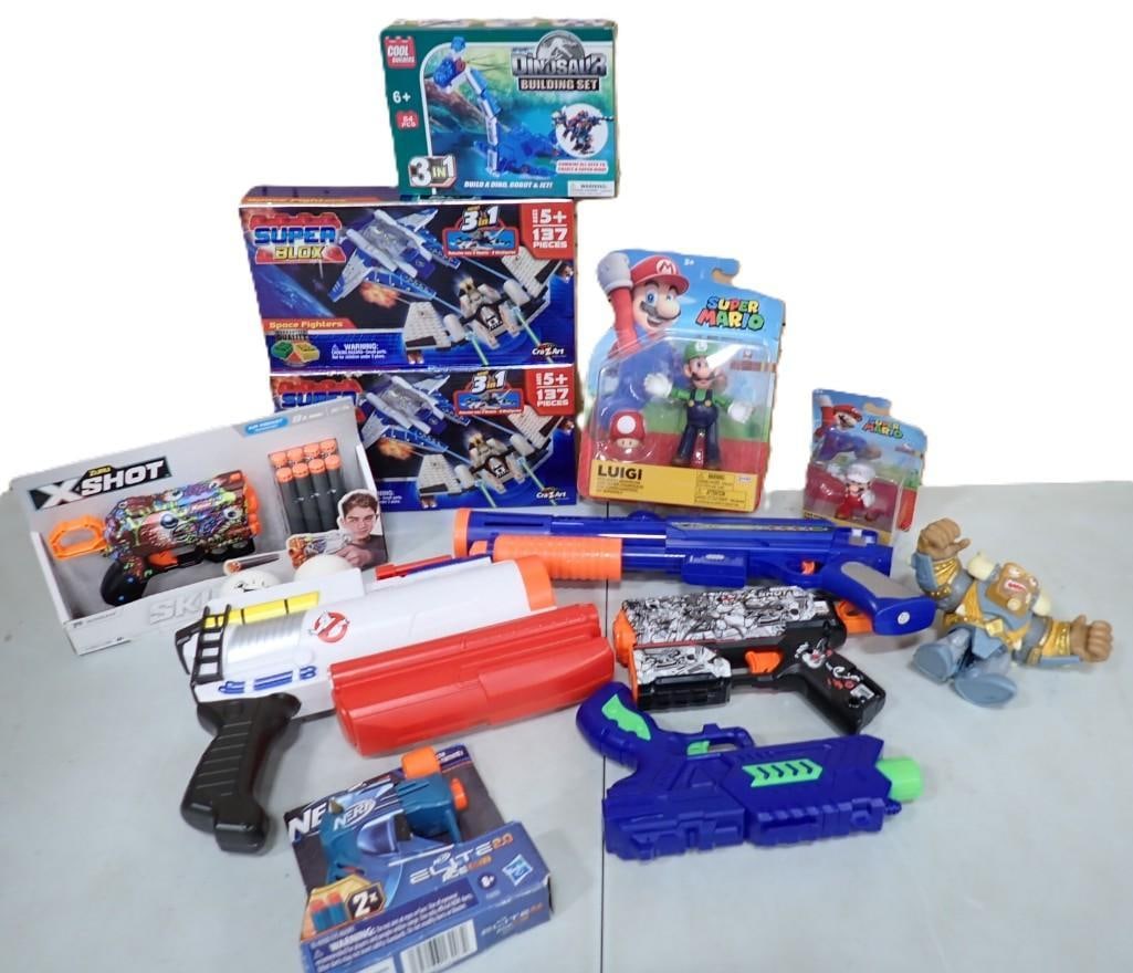 Toy Lot including Super Mario, Super Blox, X-Shot, Ghostbusters, Nerf Guns, Dinosaur Building Set, (1 of 11)