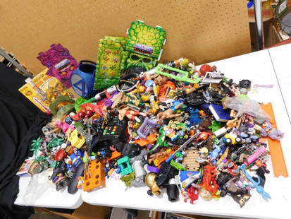 Large Bin full of assorted Toys and Action Figures, Masters of the Universe, etc.: Large Bin full of assorted Toys and Action Figures, Masters of the Universe, etc.  All pictures are considered part of the description and should be examined carefully by bidders.  Live Auctioneers is