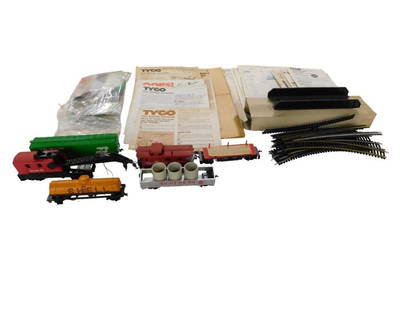 Model Train / Accessories Lot including HO Scal Track, Tyco Manuals, Trains, etc.: Model Train / Accessories Lot including HO Scal Track, Tyco Manuals, Trains, etc. All pictures are considered part of the description and should be examined carefully by bidders. Live Auctioneers is n