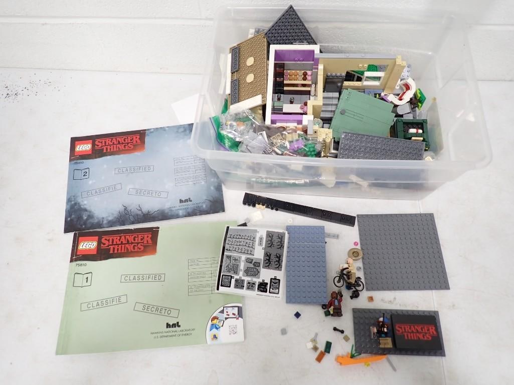 Lot of Lego Pieces with Stranger Things Manuals Approx 5 lbs Including the Bin: Lot of Lego Pieces with Stranger Things Manuals Approx 5 lbs Including the Bin All pictures are considered part of the description and should be examined carefully by bidders. Live Auctioneers is no