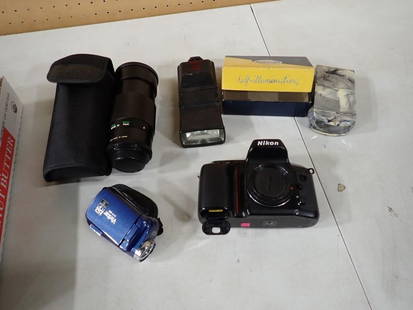 Camera / Accessories Lot including Nikon, Flashes, Lenses, Vivitar, etc. Untested: Camera / Accessories Lot including Nikon, Flashes, Lenses, Vivitar, etc. Untested May have been used in Movies and/or TV Shows as Props NO COA or Paperwork The consignor worked on multiple movies and