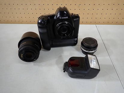 Camera Lot including Canon EOS-1N, Lenses, Flash: Camera Lot including Canon EOS-1N, Lenses, Flash May have been used in Movies and/or TV Shows as Props NO COA or Paperwork The consignor worked on multiple movies and TV shows and this movie or TV pro