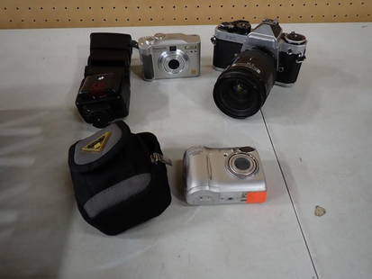 Camera Lot including Nikon FE2, Panasonic DMC LCD, Coolpix, etc: Camera Lot including Nikon FE2, Panasonic DMC LCD, Coolpix, etc May have been used in Movies and/or TV Shows as Props NO COA or Paperwork The consignor worked on multiple movies and TV shows and this