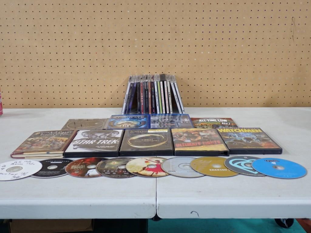 Lot of assorted DVDs and CDs including Star Trek, Watchmen, Moulin Rouge, Billy Joel, Norah Jones, e: Lot of assorted DVDs and CDs including Star Trek, Watchmen, Moulin Rouge, Billy Joel, Norah Jones, etc. All pictures are considered part of the description and should be examined carefully by bidders.