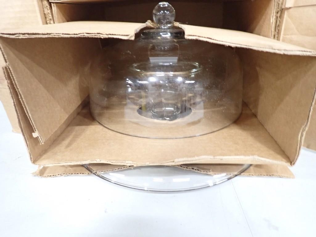 New in Open Box Glass Plain Cake Stand with Cover: New in Open Box Glass Plain Cake Stand with Cover All pictures are considered part of the description and should be examined carefully by bidders. Live Auctioneers is now offering Live Shipping throug