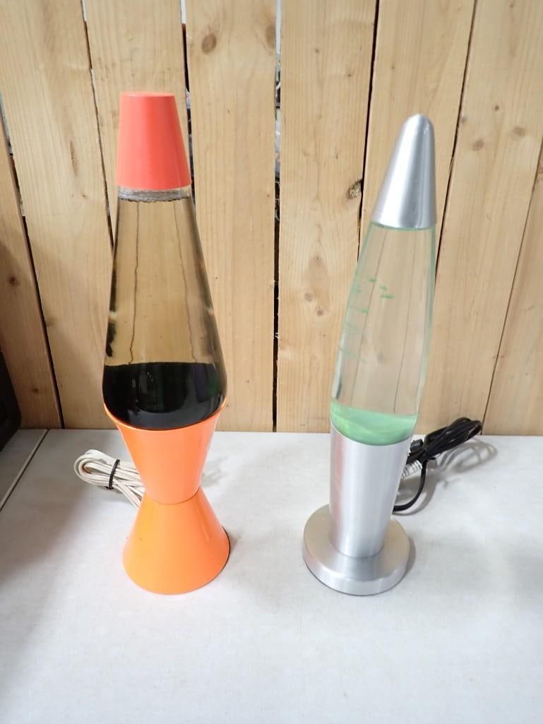 Lot of 2 Vintage Lava Lamps incl Black/Orange and Silver/Green Tested and Working: Lot of 2 Vintage Lava Lamps incl Black/Orange and Silver/Green Tested and Working All pictures are considered part of the description and should be examined carefully by bidders. Live Auctioneers is n