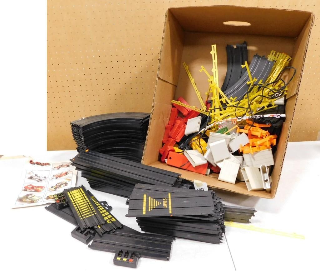 Large Lot of Slot Car Track and Accessories, etc.: Large Lot of Slot Car Track and Accessories, etc. All pictures are considered part of the description and should be examined carefully by bidders. Live Auctioneers is now offering Live Shipping throug