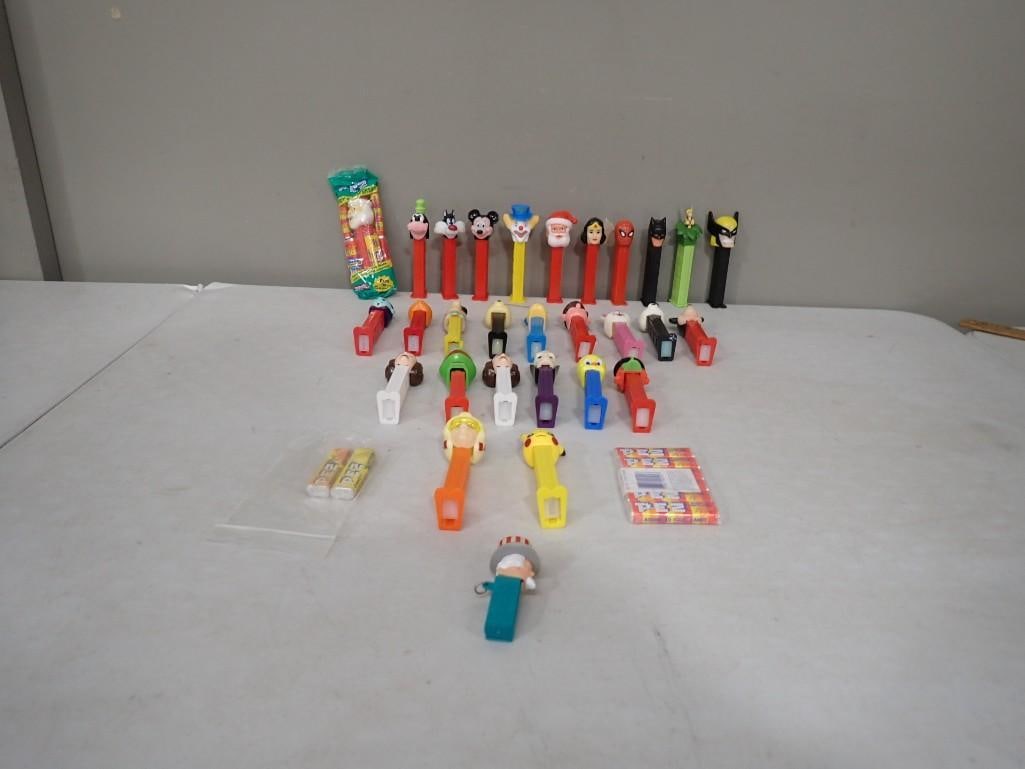 Lot of Pez Dispensers including Batman, Disney, Spiderman, Wonder Woman, Pokemon, etc.: Lot of Pez Dispensers including Batman, Disney, Spiderman, Wonder Woman, Pokemon, etc. All pictures are considered part of the description and should be examined carefully by bidders. Live Auctioneers
