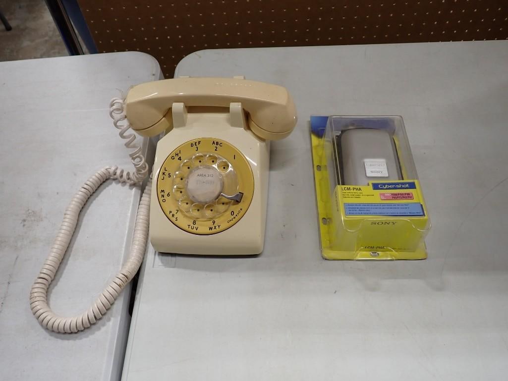 Vintage Rotary Dial Telephone and a Sony Cyber-Shot Carrying Case: Vintage Rotary Dial Telephone and a Sony Cyber-Shot Carrying Case All pictures are considered part of the description and should be examined carefully by bidders. Live Auctioneers is now offering Live