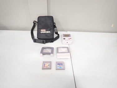 Nintendo Lot including Gameboy System (untested), case, Super Mario World, Pac-Man, Light Accessorie