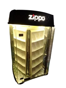 Zippo Lighter Store Display - it lights up and rotates and works. Measures roughly 27x16x16"
