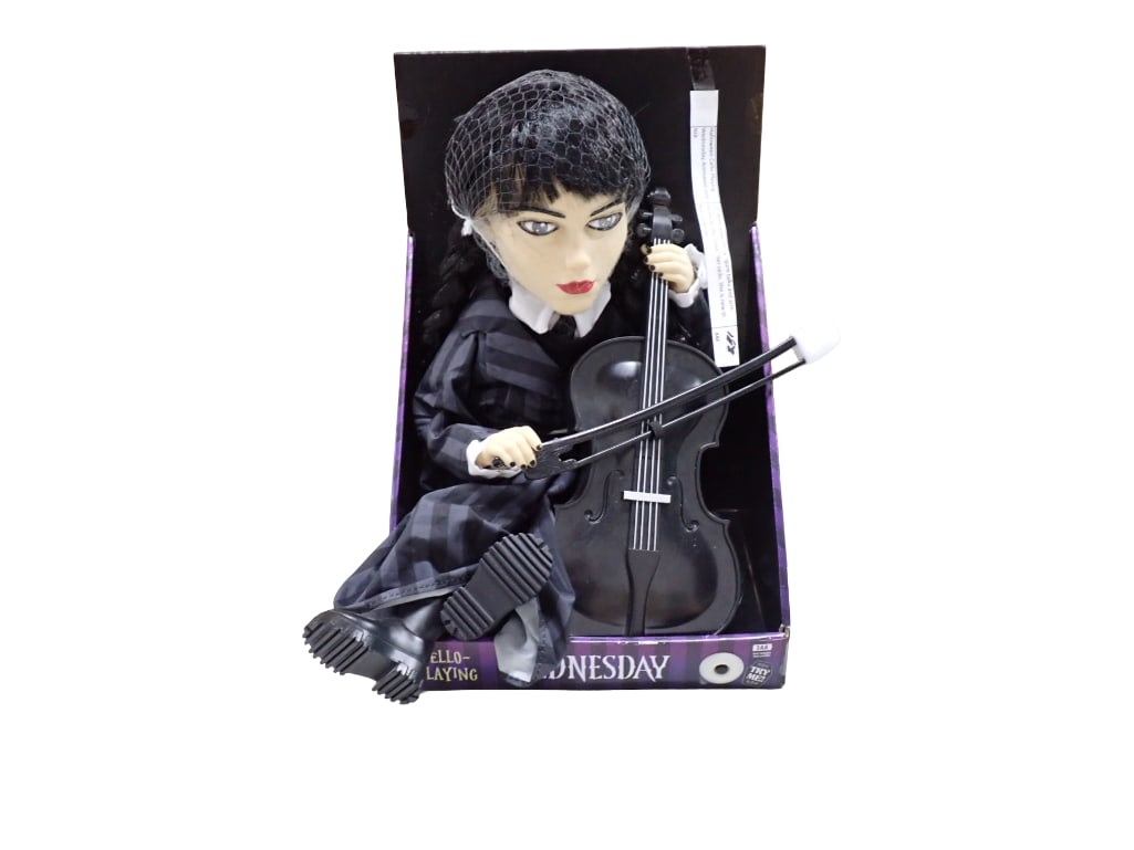 Halloween Cello Playing Wednesday Animated Doll NIB New in Box: 13" Wednesday sitting figure talks and arm moves as she "plays" her cello. She is new in box by MGM. All pictures are considered part of the description and should be examined c