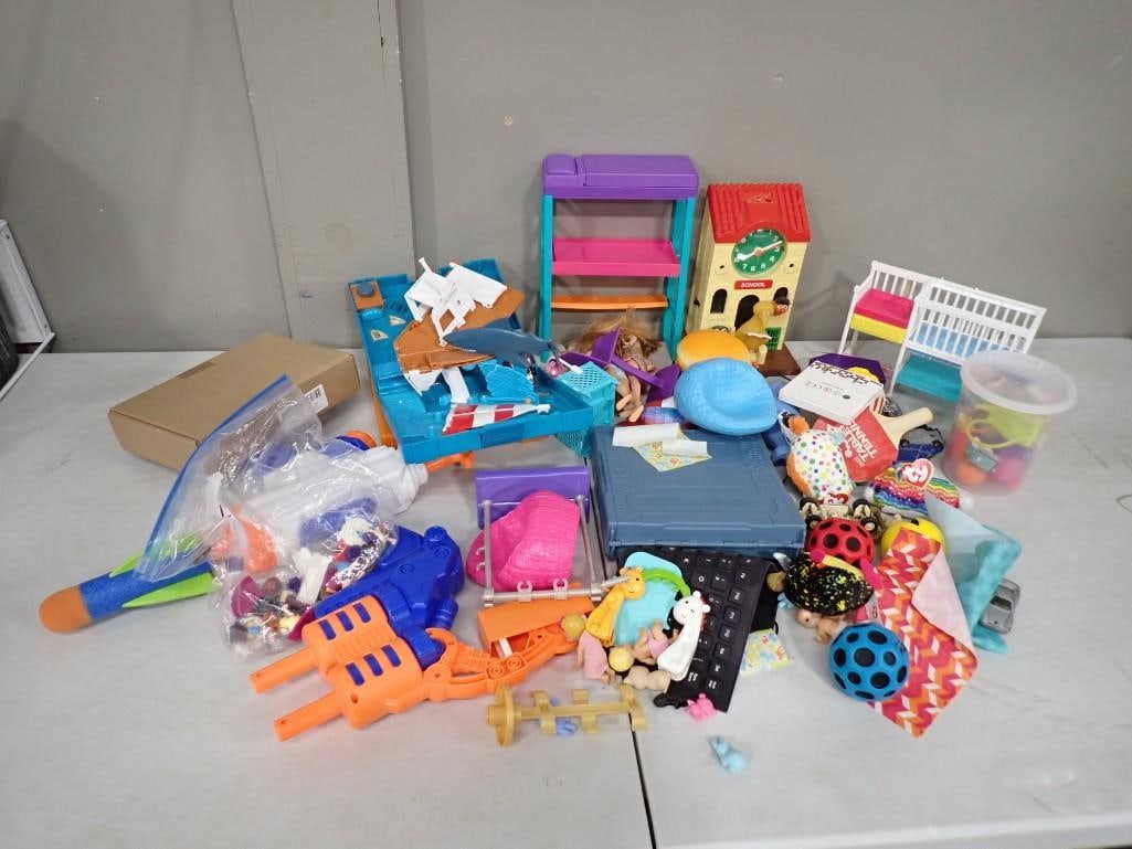 Misc. Toy Lot including Nerf, Sesame Street Wind Up Clock, Barbie Accessories, Party Favors, etc.: Misc. Toy Lot including Nerf, Sesame Street Wind Up Clock, Barbie Accessories, Party Favors, Matchbox Cases, etc. All pictures are considered part of the description and should be examined carefully b
