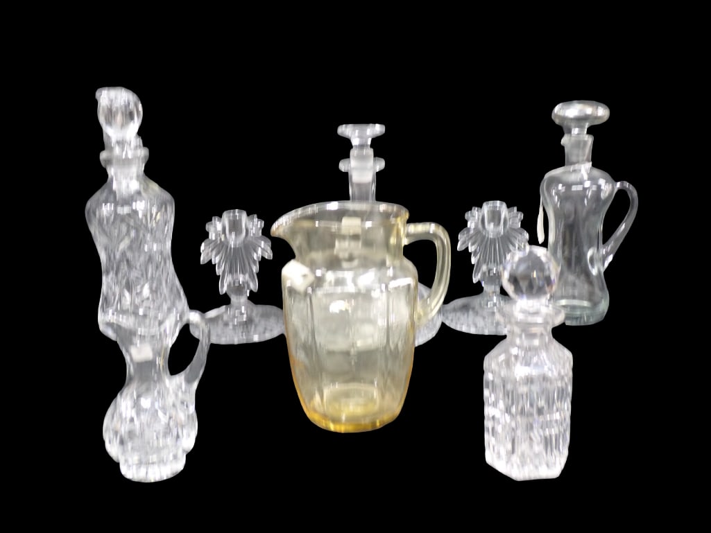 Lot of Glassware incl Candlesticks, Pitcher, Decanters, Etc Asst Patterns: Lot of Glassware incl Candlesticks, Pitcher, Decanters, Ship's Captain Decanter, Etc in Asst Patterns All pictures are considered part of the description and should be examined carefully by bidde