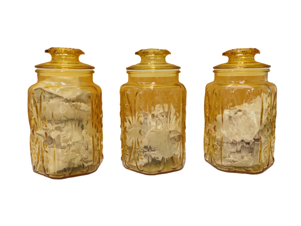 Set of 3 Vintage L.E. Smith Atterbury Scroll 9" Amber Canisters: Set of 3 Vintage L.E. Smith Atterbury Scroll 9" Amber Canisters. All pictures are considered part of the description and should be examined carefully by bidders. Live Auctioneers is now offering L