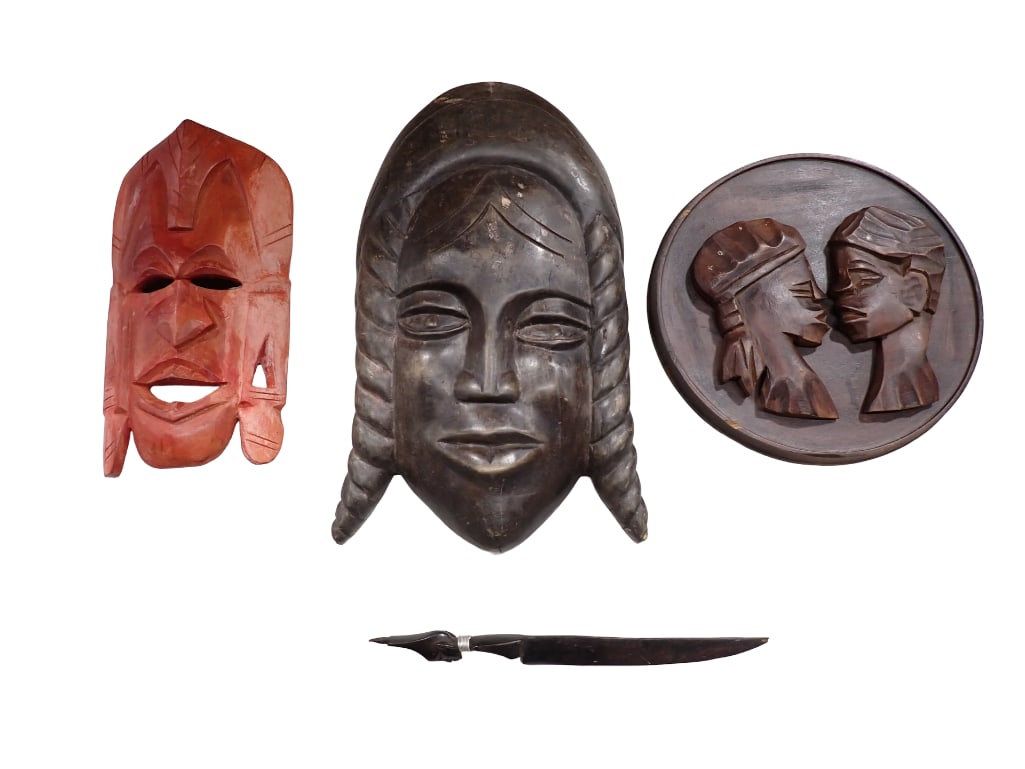 Carved Wood Masks, Wall Hangings, and a Decorative Carved Knife or Letter Opener: Carved Wood Masks, Wall Hangings, and a Decorative Carved Knife or Letter Opener All pictures are considered part of the description and should be examined carefully by bidders. Live Auctioneers is no
