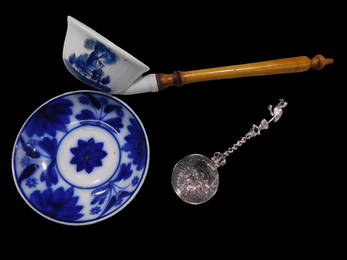 Dutch Collectible Lot. One .833 silver spoon with a bowl decorated with a scene of a girl carrying t