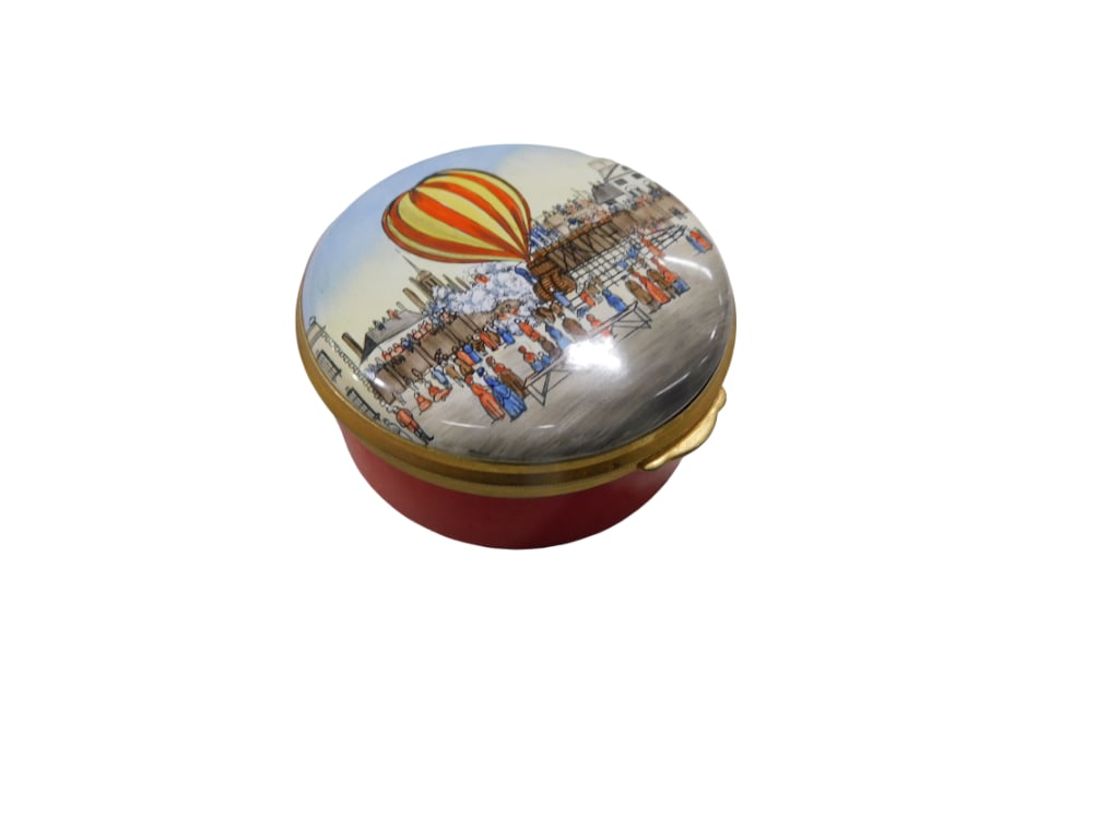 An English Staffordshire Bilston Battersea enamel box. Round box depicting a hot air balloon on cove (1 of 3)