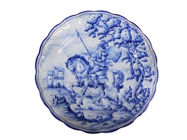 Spanish Talavera Blue and White Faience Charger depicting a man on horseback, possibly Don Quixote.