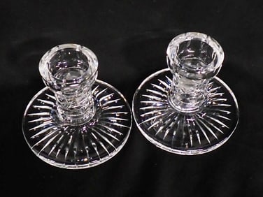 A pair of Waterford crystal single light candlesticks 3 3/4" x 4 1/4"