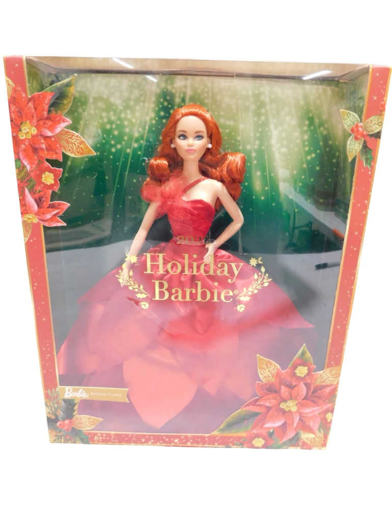 2022 Signature Holiday Barbie Red Hair NRFB (Rare): 2022 Signature Holiday Barbie with red hair and model muse body. She was the first holiday Barbie produced with red hair. New, never removed from box. All pictures are considered part of t