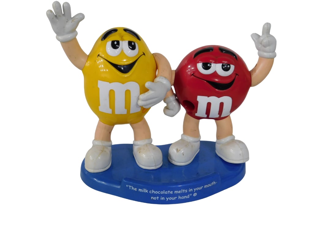 Yellow and Red M&Ms Candy Dispenser: Yellow and Red M&Ms Candy Dispenser All pictures are considered part of the description and should be examined carefully by bidders. Live Auctioneers is now offering Live Shipping through them. Th