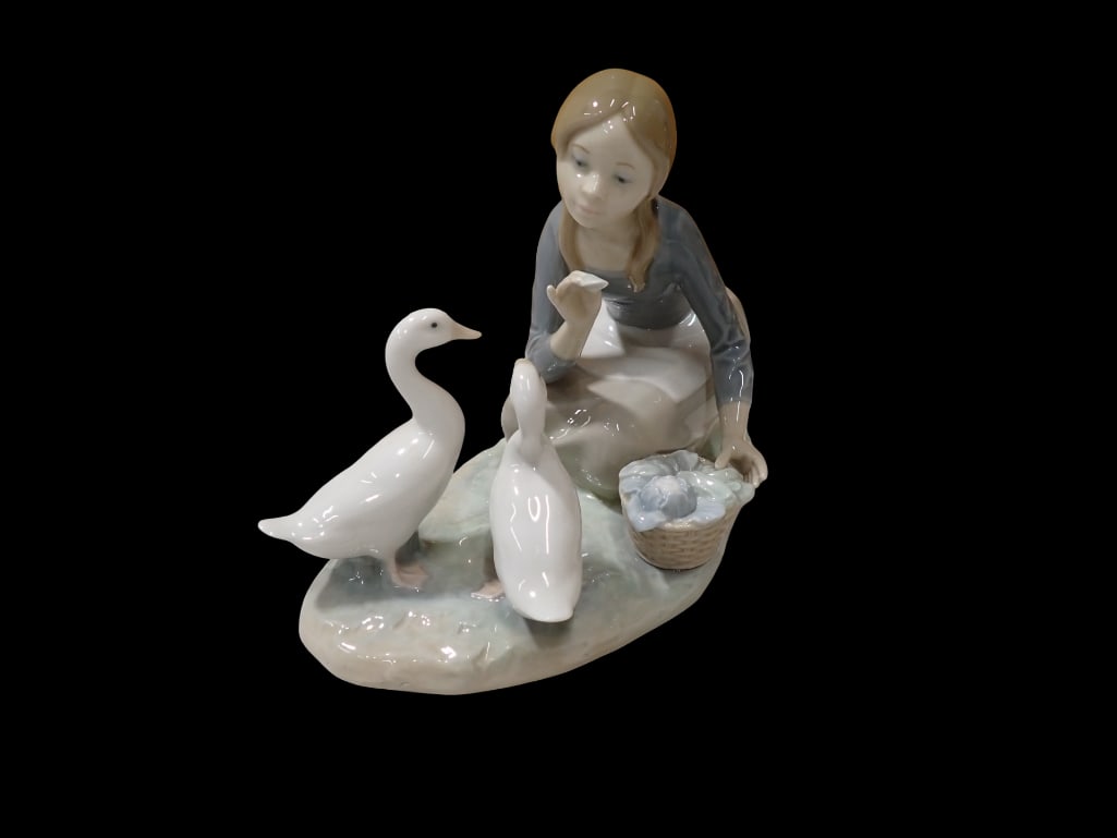 Lladro 4849 Feeding the Ducks Porcelain Figurine: Lladro 4849 Feeding the Ducks Porcelain Figurine All pictures are considered part of the description and should be examined carefully by bidders. Live Auctioneers is now offering Live Shipping throu