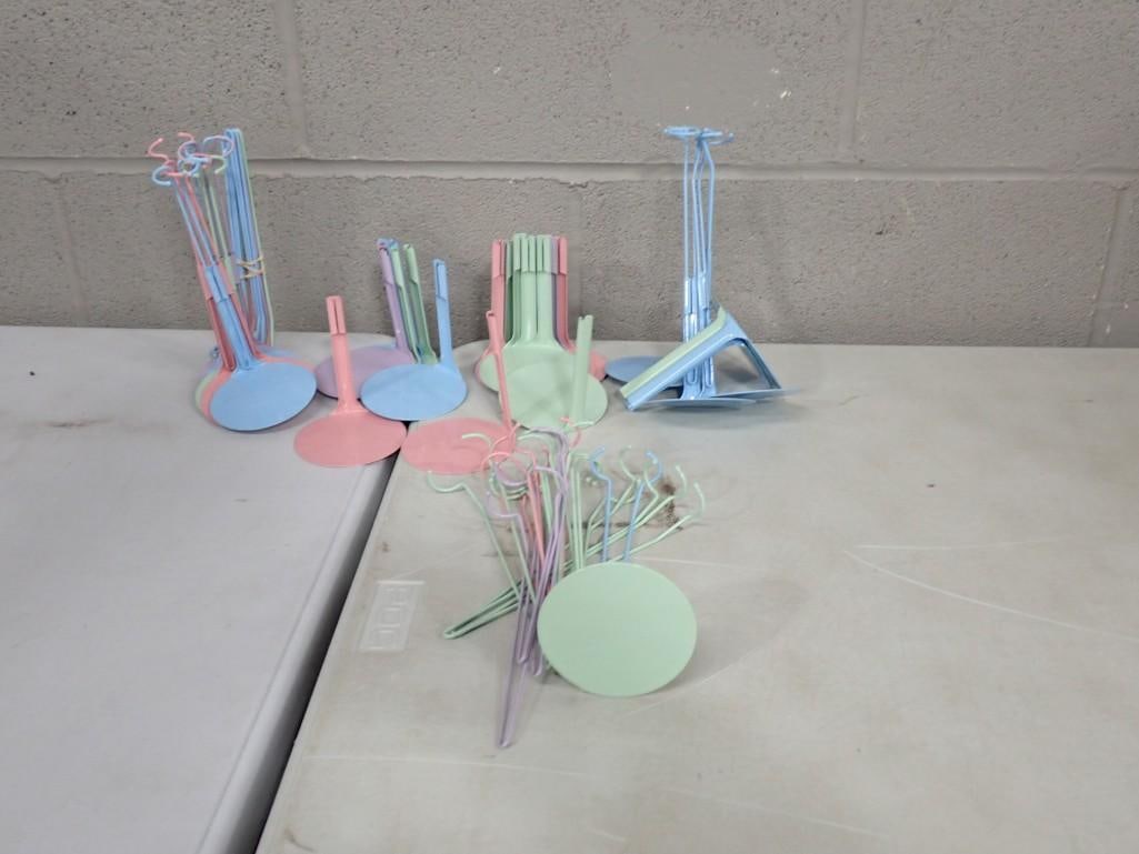 Large Lot of Pastel Colored Doll Stands: Large Lot of Pastel Colored Doll Stands All pictures are considered part of the description and should be examined carefully by bidders. Live Auctioneers is now offering Live Shipping through them.