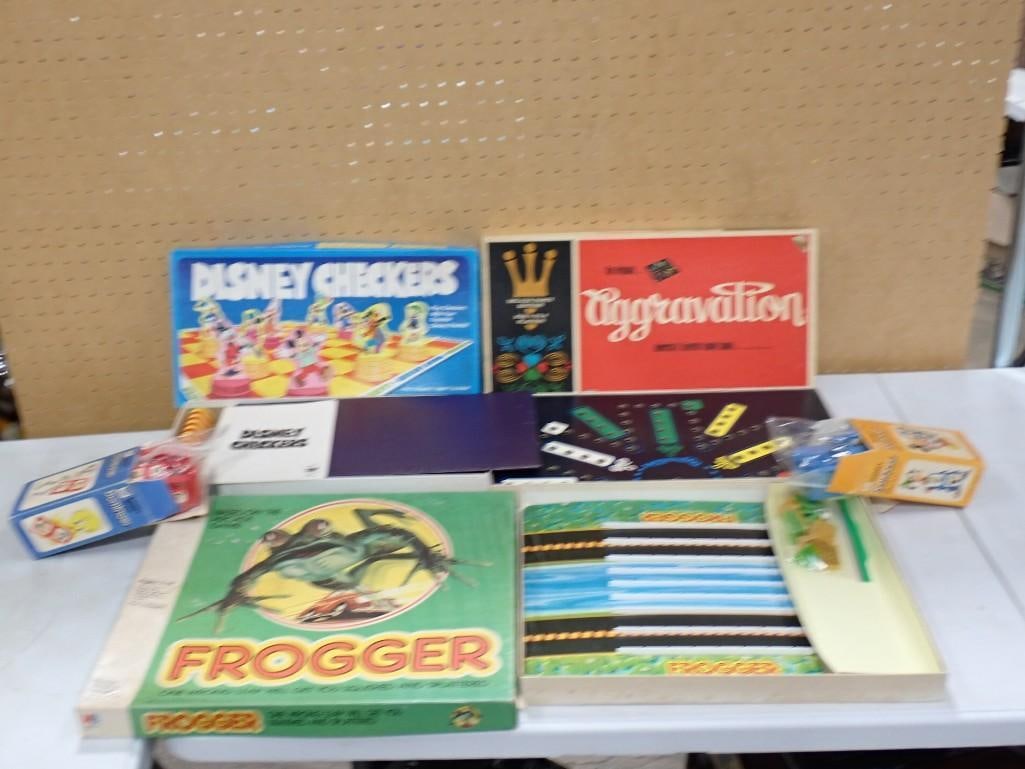 Vintage Board Game Lot including Frogger, Disney Checkers, Aggravation, Dominos (missing 1), etc.: Vintage Board Game Lot including Frogger, Disney Checkers, Aggravation, Dominos (missing 1), etc. All pictures are considered part of the description and should be examined carefully by bidders. Live