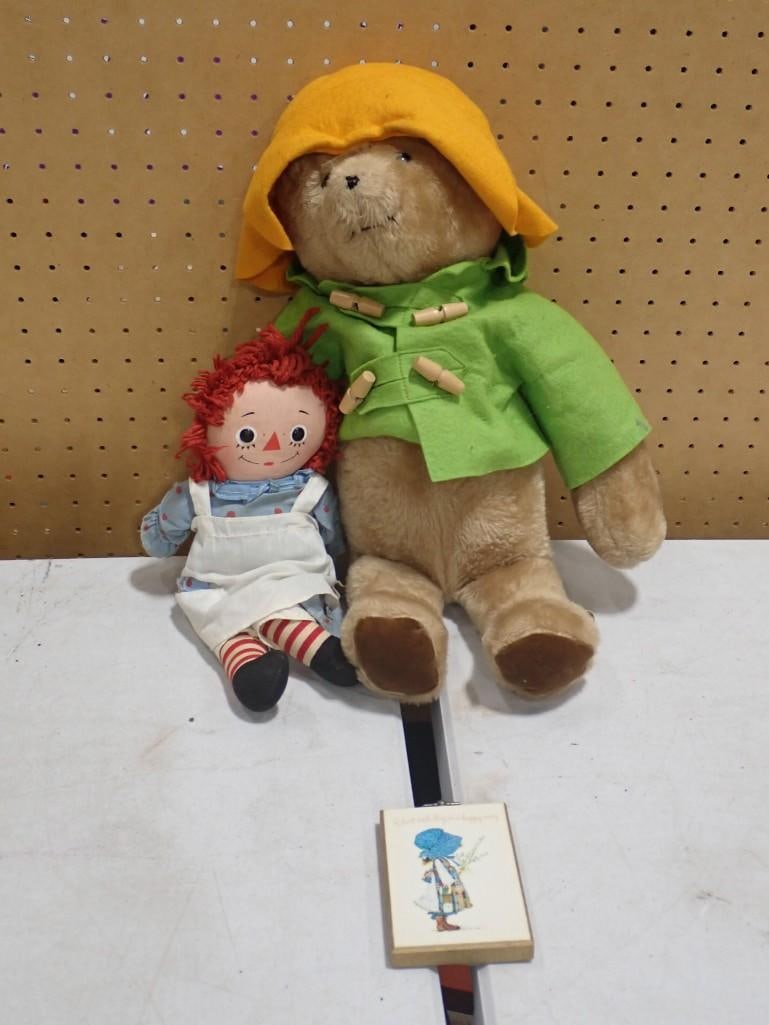 Vintage Talking Raggedy Ann Doll, Holly Hobbie Wall Plaque, Paddington Bear: Vintage Talking Raggedy Ann Doll, Holly Hobbie Wall Plaque, Paddington Bear All pictures are considered part of the description and should be examined carefully by bidders. Live Auctioneers is now o