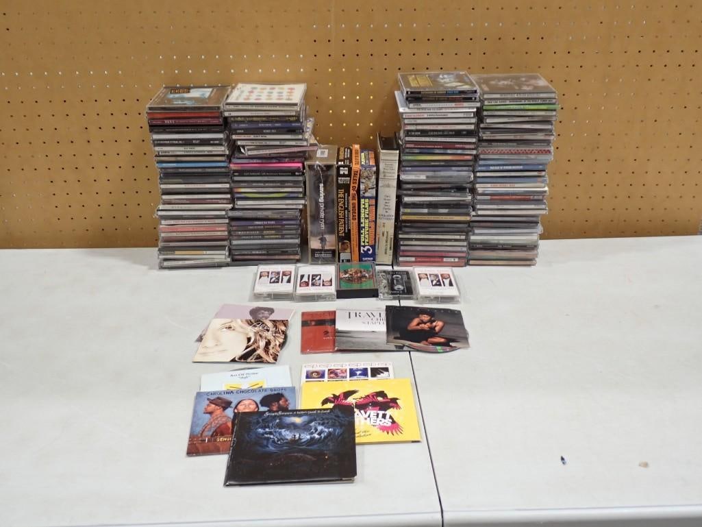 Lot of CDs, Cassettes, etc incl Tina Turner, Evita, George Michael, Traveling Wilburys, RuPaul, (1 of 12)