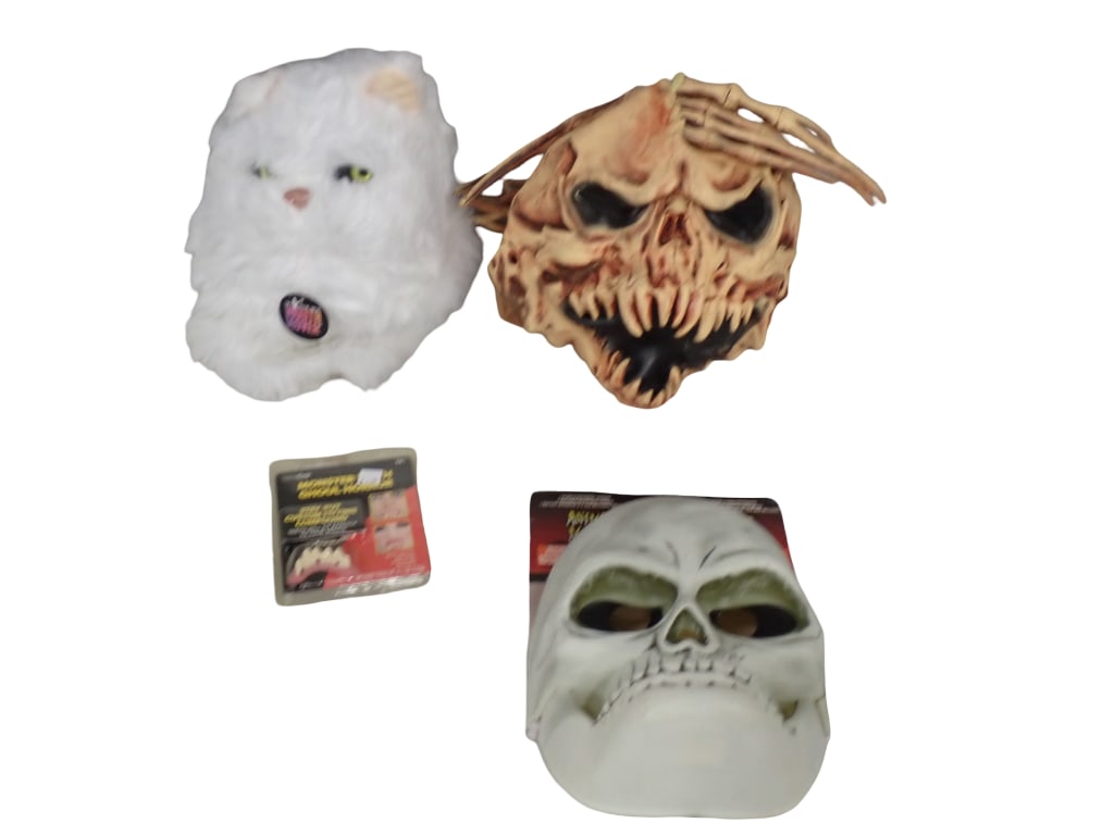 Halloween Lot incl Elope Mouth Movers Cat, Skull Animated Mask with Sound,: Halloween Lot incl Elope Mouth Movers Cat, Skull Animated Mask with Sound, Scary Monster Head - Makes sounds, has one spike on it's head with damage, New in Package Monster Teeth All pictures are 