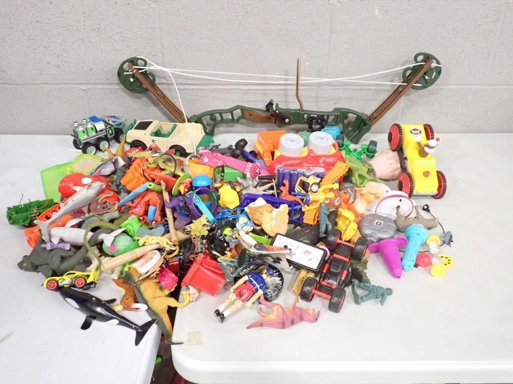 Lot of Small Toys, Toy Cars, Trucks, Toy Bow, Etc: Lot of Small Toys, Toy Cars, Trucks, Toy Bow, Etc All pictures are considered part of the description and should be examined carefully by bidders. Live Auctioneers is now offering Live Shipping throug