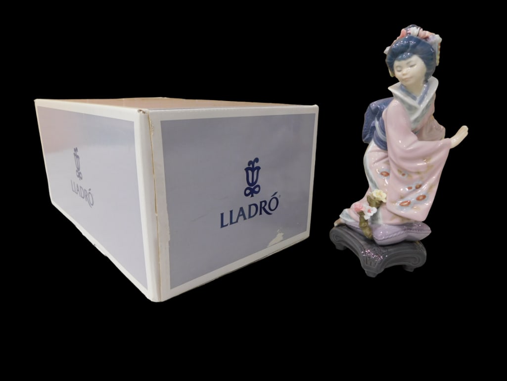 Lladro 1447 Michico Porcelain Figurine w/ Box and Paperwork: Lladro 1447 Michico Porcelain Figurine w/ Box and Paperwork All pictures are considered part of the description and should be examined carefully by bidders. Live Auctioneers is now offering Live Shi