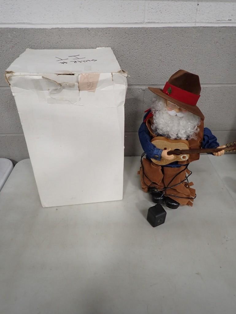 Animatronic Cowboy Santa Claus that plays music: Animatronic Cowboy Santa Claus that plays music All pictures are considered part of the description and should be examined carefully by bidders. Live Auctioneers is now offering Live Shipping thr