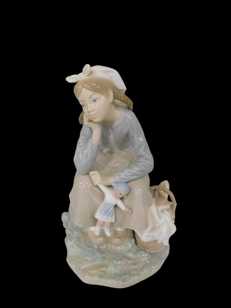 Lladro Dutch Girl with Doll Porcelain Figurine: Lladro Dutch Girl with Doll Porcelain Figurine All pictures are considered part of the description and should be examined carefully by bidders. Live Auctioneers is now offering Live Shipping through t