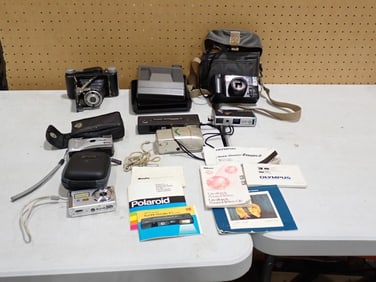 Camera Lot including Vintage Tower Camera, Kodak 110, Polaroid, 35mm, Sony Digital, manuals, etc.