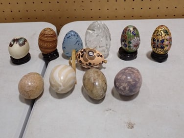 Lot of decorative eggs including Cloisonne, carved Stone, Glass, etc.