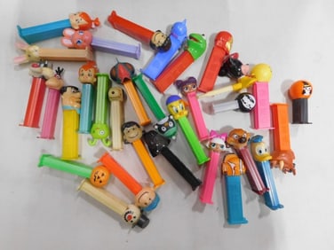 Pez Dispensers including Vintage, Peanuts, Flintstones, Looney Toons, Halloween, Lion King, Disney