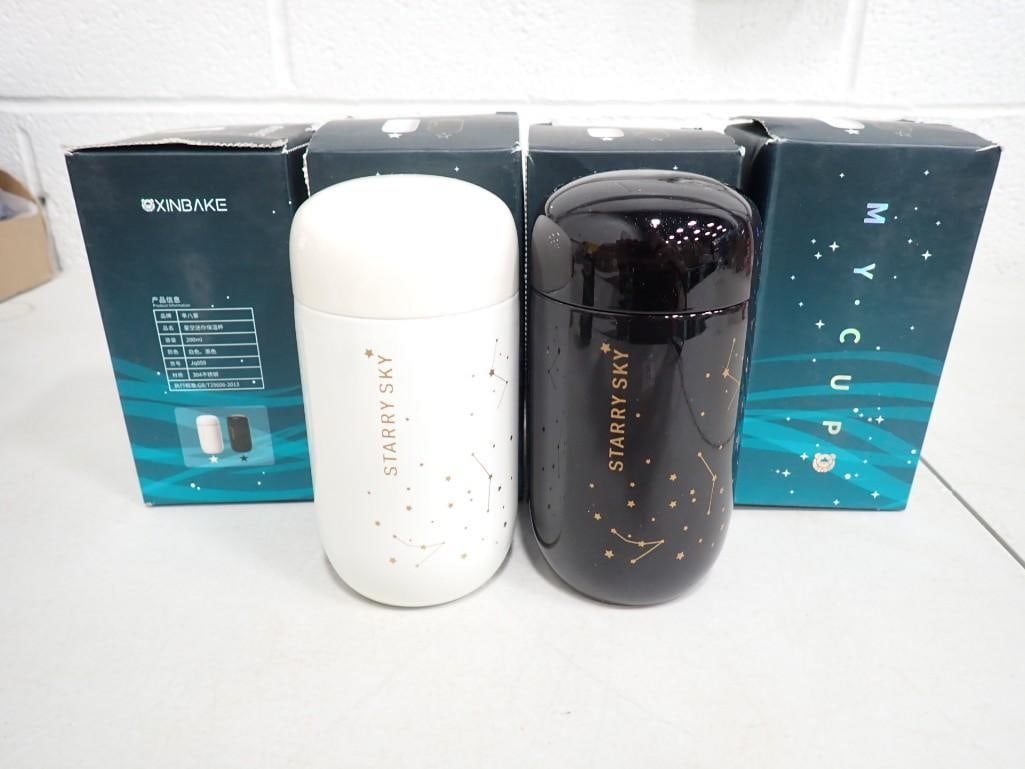 4 Xinbake Stainless Steel Insulated Travel Cups New in Box incl 2 Black and 2 White: 4 Xinbake Stainless Steel Insulated Travel Cups New in Box incl 2 Black and 2 White All pictures are considered part of the description and should be examined carefully by bidders. Live Auctioneers is