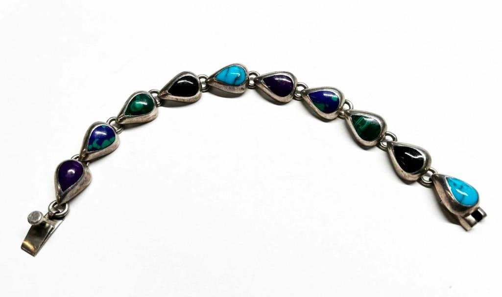 Sterling Silver and Gemstone Bracelet 30 grams Malachite , Turquoise and More: Sterling Silver and Gemstone Bracelet 30 grams Malachite , Turquoise and More. Beautiful condition, needs polishing. All pictures are considered part of the description and should be examined c