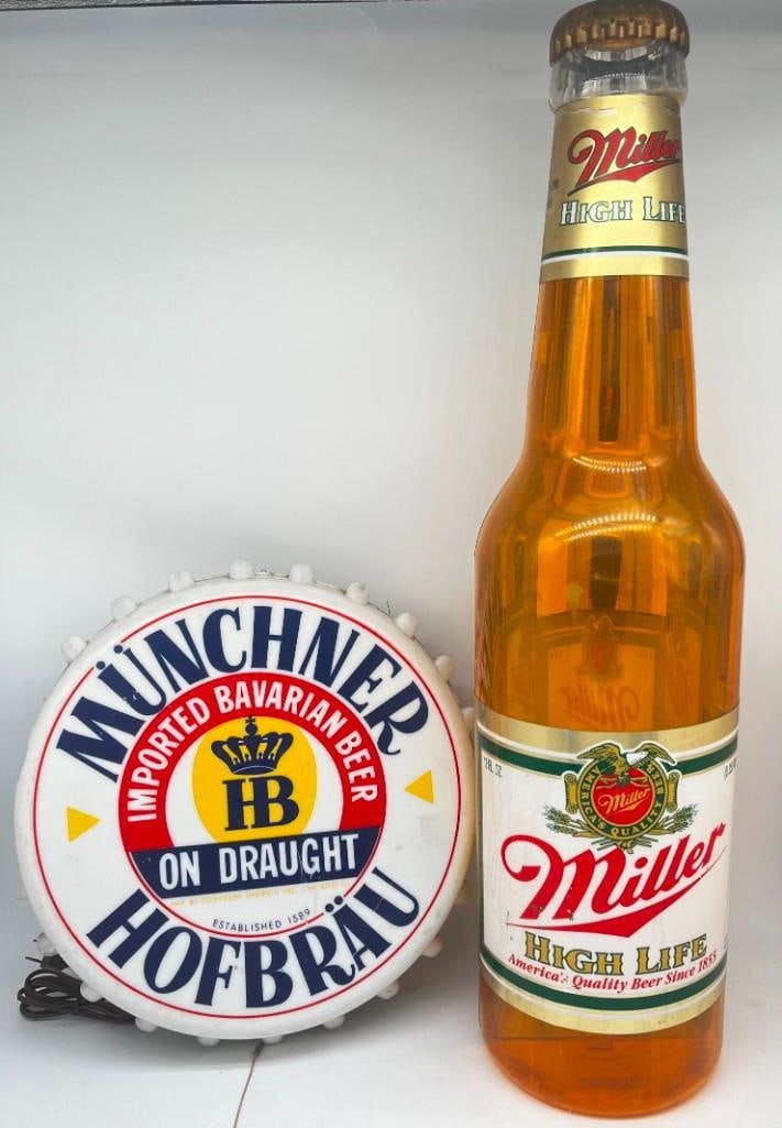 Miller High Life Beer Advertising Large Bottle & Munchner Ed Bavarian Haufbrau Sign: Miller High Life Beer Advertising Large Bottle & Munchner Ed Bavarian Haufbrau Sign Both are sold as is with cracks & damage, see photos for more details.30 & 15in. All pictures are consid