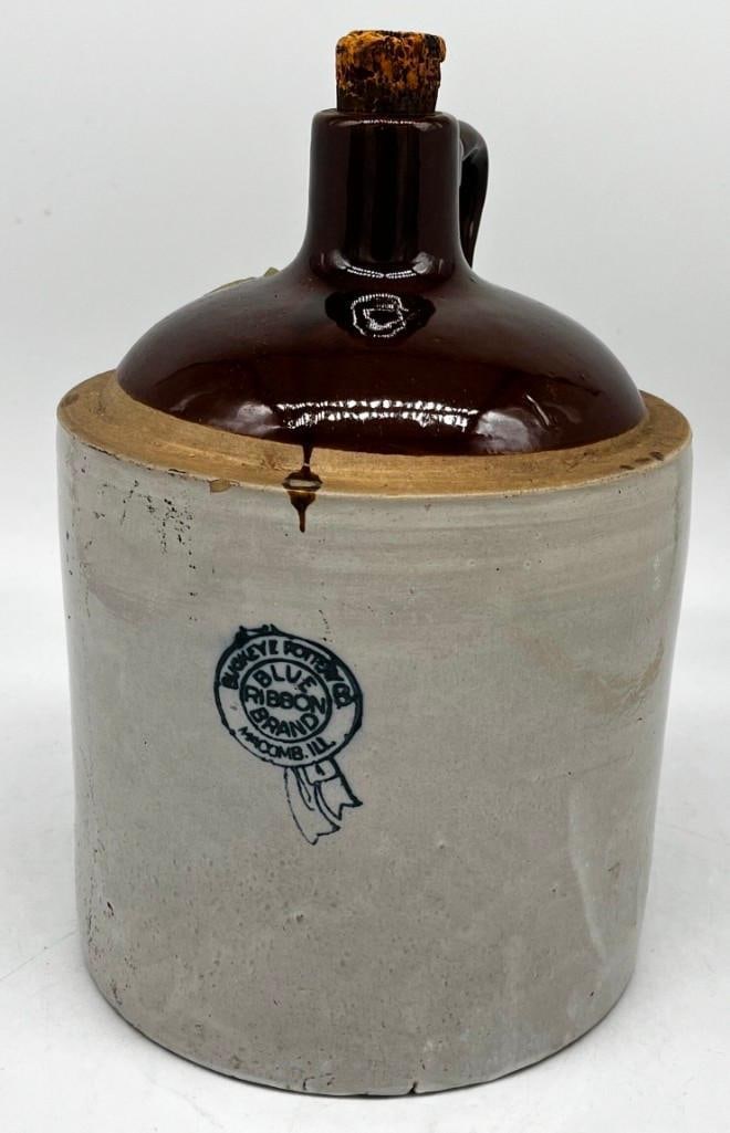 1 Gallon Stoneware Buckeye Pottery Blue Ribbon Macomb Illinois Whiskey Jug: 1 Gallon Stoneware Buckeye pottery blue ribbon Macomb Illinois whiskey jug Nice condition, 12' tall All pictures are considered part of the description and should be examined carefully by b