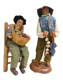 2 French Santon Figures incl 8 1/2" Man Sitting in Chair Holding a Large Basket of Vegetables and