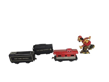 T.P.S. tin lithographed wind-up Mechanical Roller Clown and 3 Marx O Scale Trains