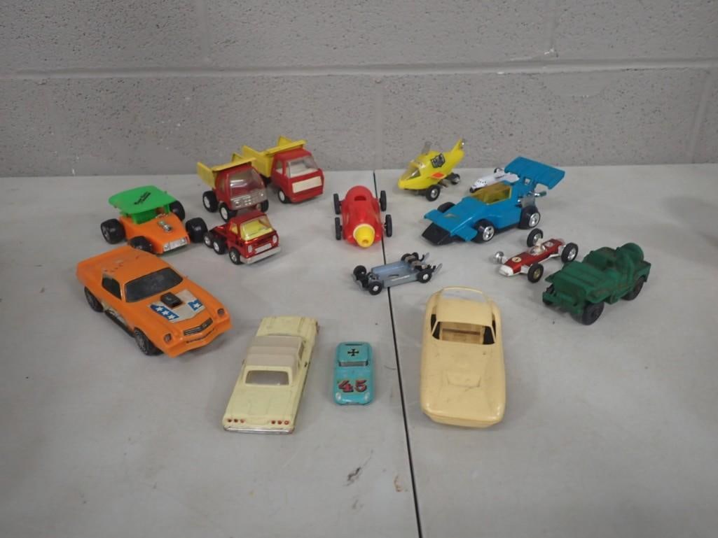 Lot of assorted Toy Cars and Trucks, etc. Including Vintage, Racecars, etc.: Lot of assorted Toy Cars and Trucks, etc. Including Vintage, Race cars, etc. All pictures are considered part of the description and should be examined carefully by bidders. Live Auctioneers is now of